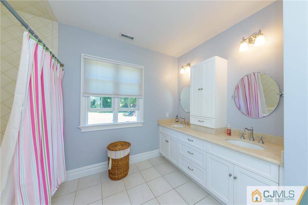 40 Pickle Road Califon, NJ 07830 - Photo 32 of 50 a bathroom with a sink and a mirror