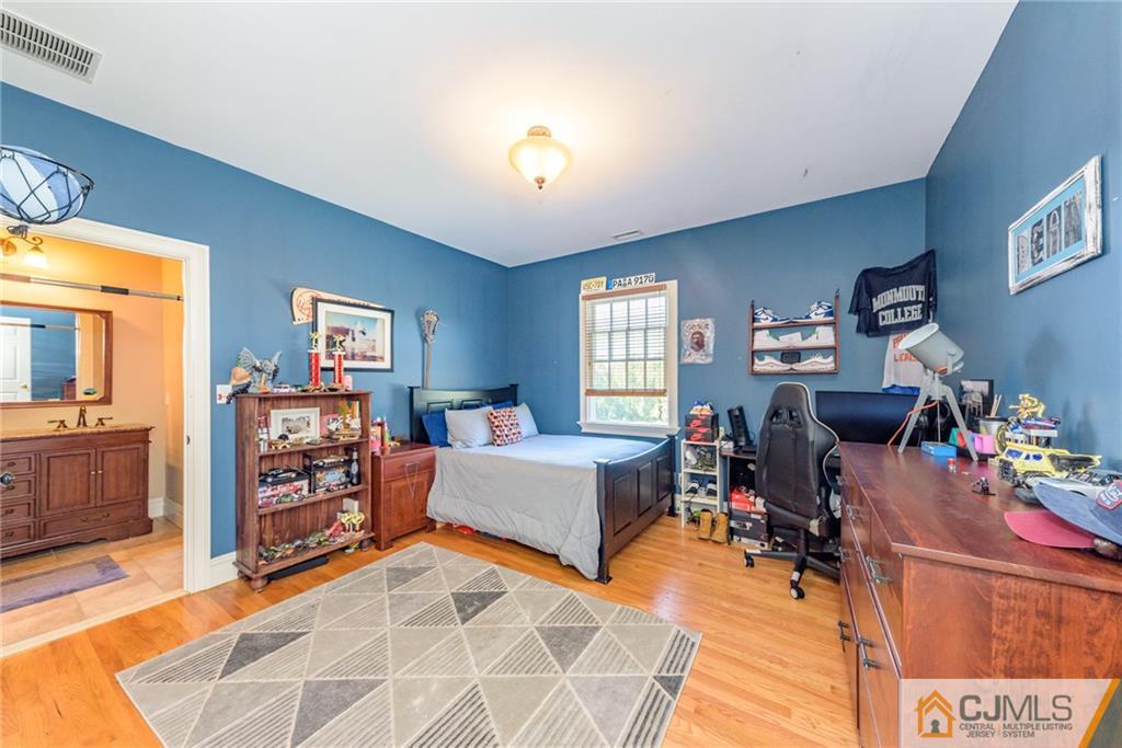 40 Pickle Road Califon, NJ 07830 - Photo 33 of 50 a bedroom with furniture and a wooden floor