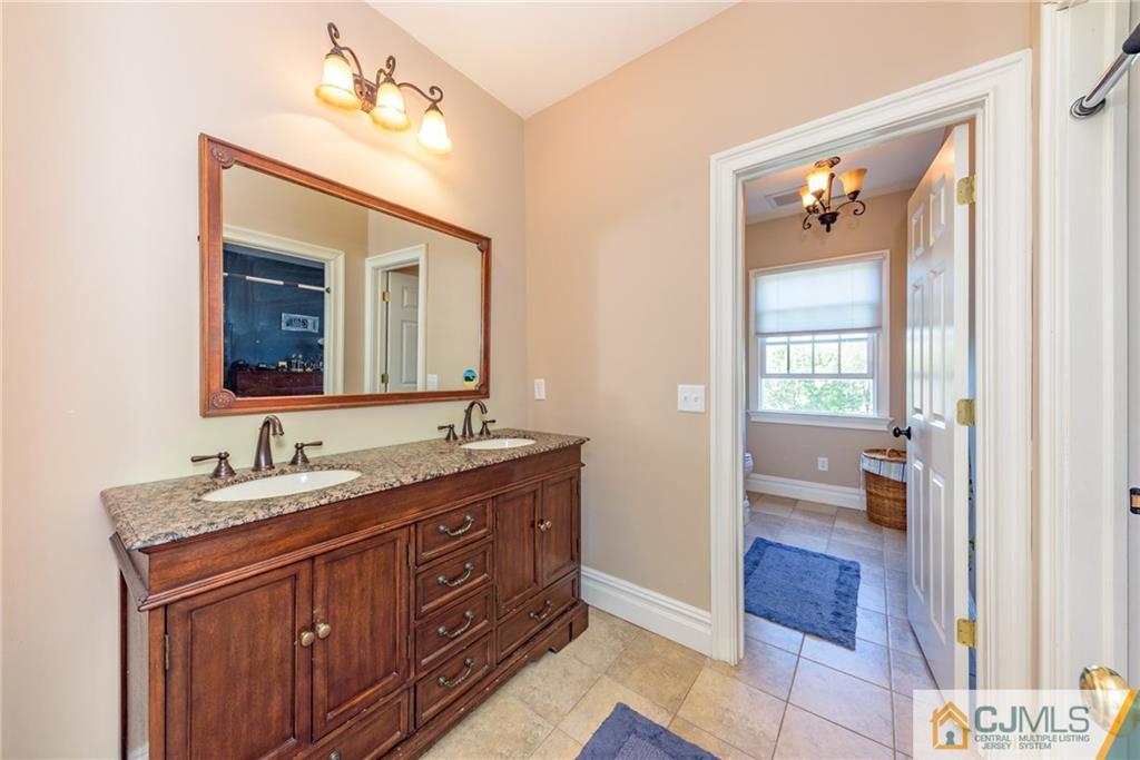40 Pickle Road Califon, NJ 07830 - Photo 34 of 50 a en suite bathroom with a double vanity sink and a mirror