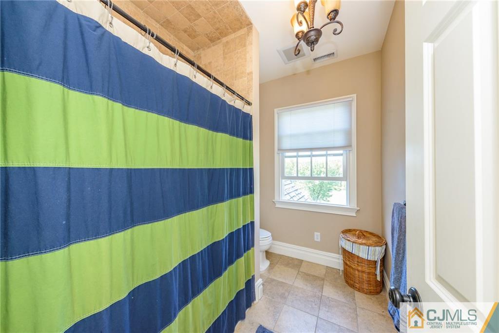 40 Pickle Road Califon, NJ 07830 - Photo 35 of 50 a kitchen with a chair and tub