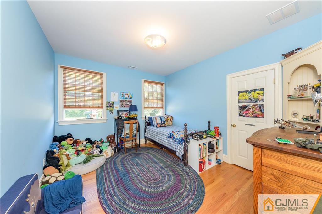40 Pickle Road Califon, NJ 07830 - Photo 36 of 50 a room with furniture a chandelier and a window