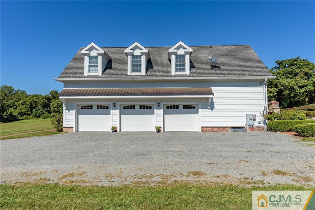 40 Pickle Road Califon, NJ 07830 - Photo 44 of 50 a front view of a house with a yard and garage