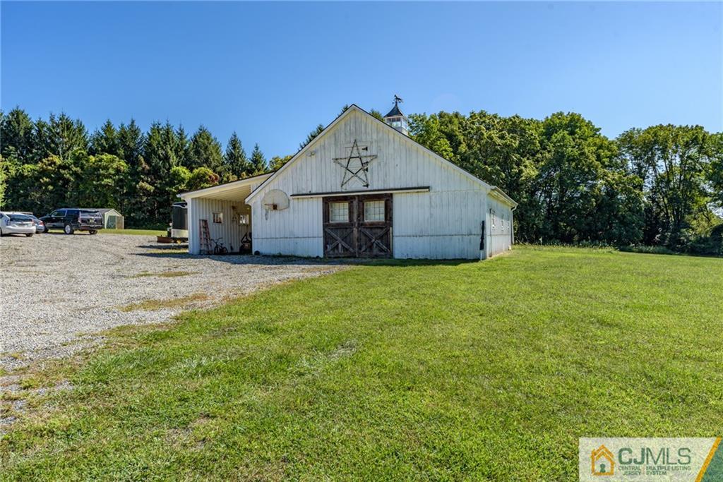 40 Pickle Road Califon, NJ 07830 - Photo 45 of 50 a view of a house with a yard and a tree
