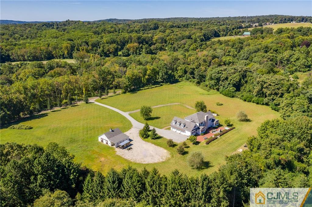40 Pickle Road Califon, NJ 07830 - Photo 48 of 50 a view of a swimming pool with a yard