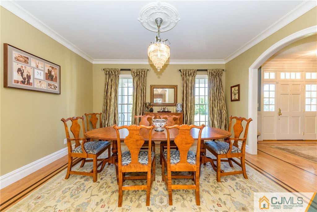 40 Pickle Road Califon, NJ 07830 - Photo 9 of 50 a view of a dining room with furniture wooden floor and a chandelier