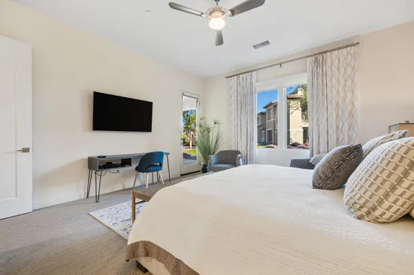 a bathroom with a double vanity sink a mirror and shower