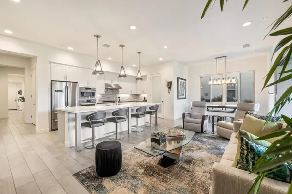 a kitchen with a stove and a white cabinets