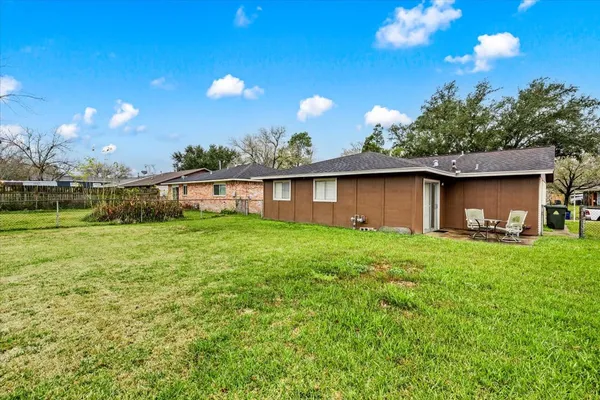 a view of backyard with a garden and entertaining space