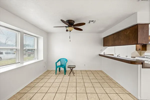a view of an empty room and window