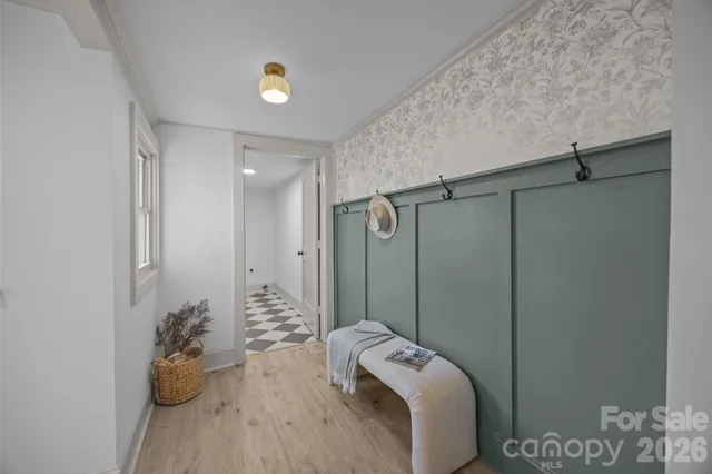 a bathroom with a black and white checkered floor