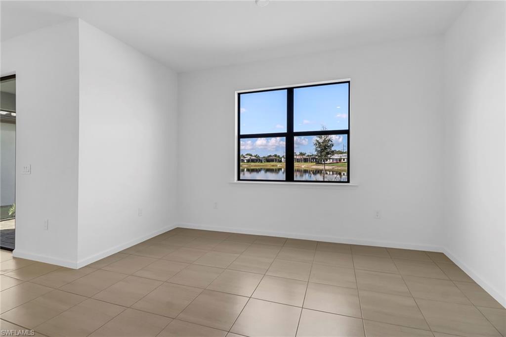 2167 Yellowfin Circle Naples, FL 34114 - Photo 11 of 36 a view of an empty room with a window