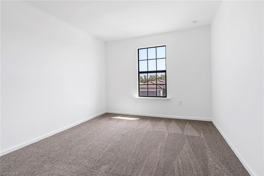 2167 Yellowfin Circle Naples, FL 34114 - Photo 22 of 36 an empty room with windows