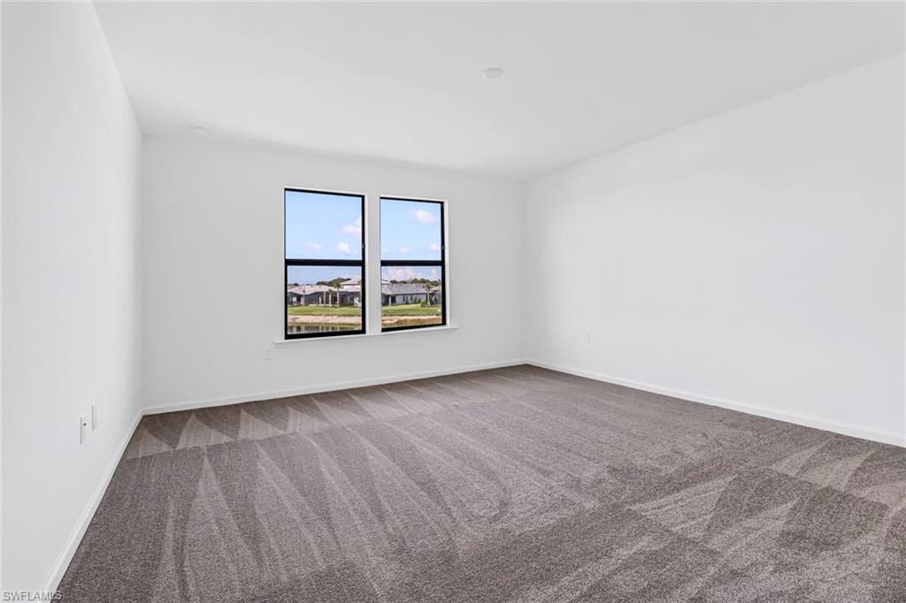 2167 Yellowfin Circle Naples, FL 34114 - Photo 25 of 36 an empty room with windows