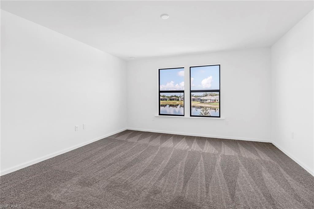 2167 Yellowfin Circle Naples, FL 34114 - Photo 26 of 36 an empty room with windows