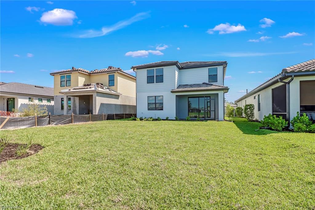 2167 Yellowfin Circle Naples, FL 34114 - Photo 36 of 36 a front view of a house with a garden