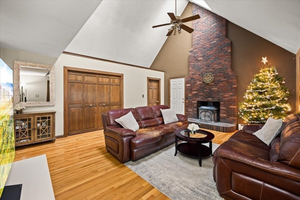211 Cherry Street Bridgewater, MA 02324 - Photo 12 of 39 a living room with furniture and a fireplace
