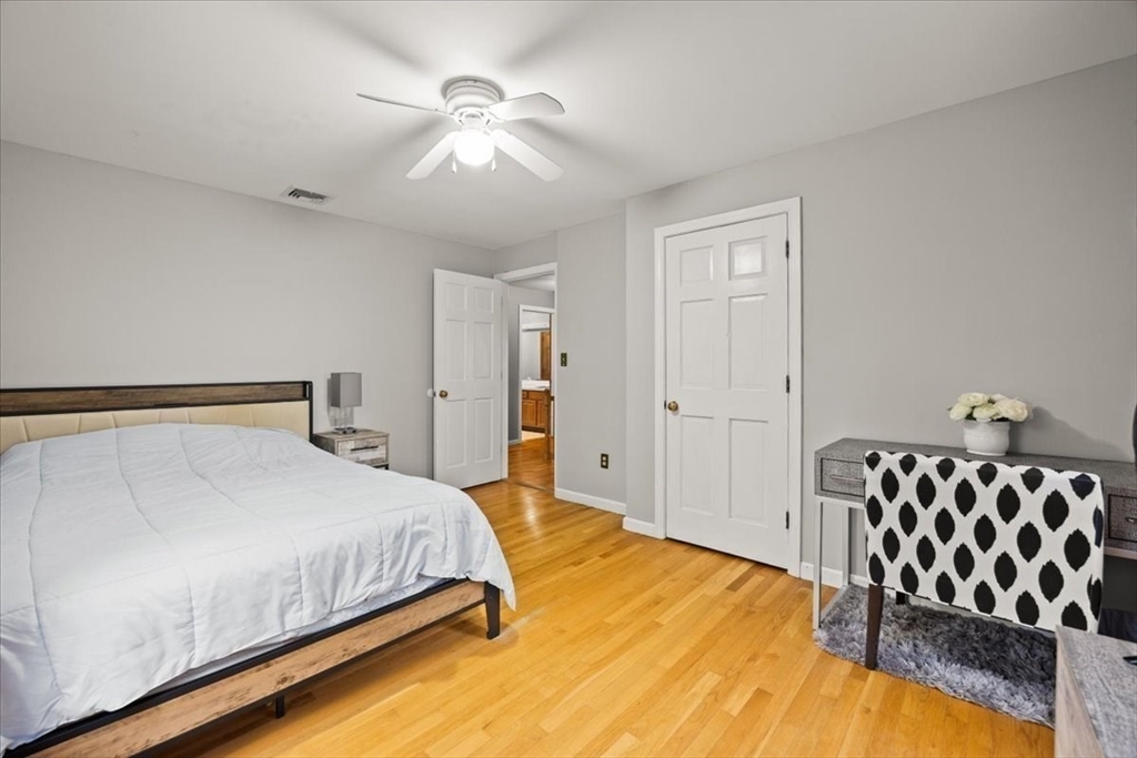 211 Cherry Street Bridgewater, MA 02324 - Photo 19 of 39 a bedroom with a bed and lamp