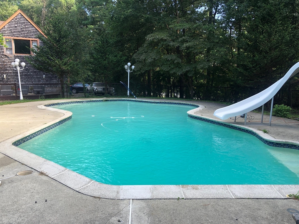 211 Cherry Street Bridgewater, MA 02324 - Photo 35 of 39 a view of a backyard with a trampoline
