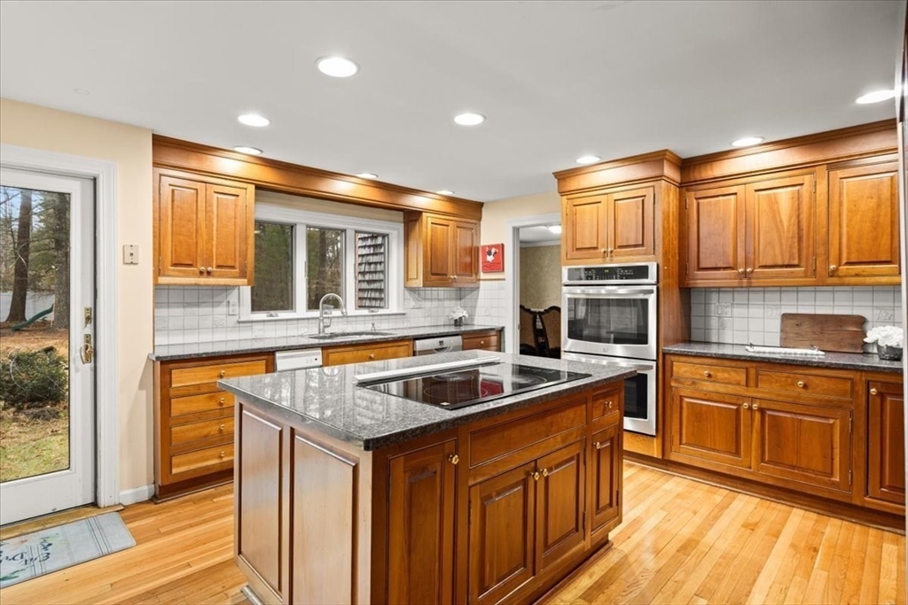 211 Cherry Street Bridgewater, MA 02324 - Photo 5 of 39 a kitchen with stainless steel appliances granite countertop a sink and a microwave