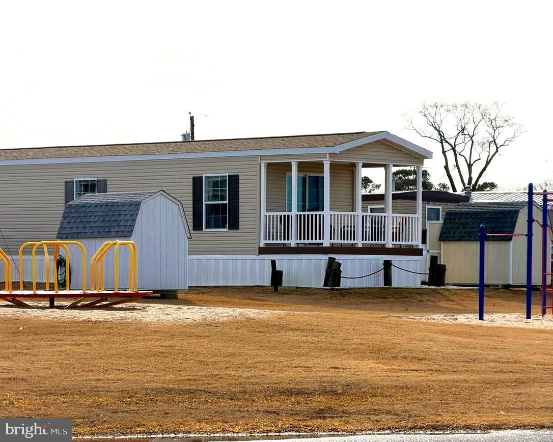 38025 Rabbit Road, Unit 101 Ocean View, DE 19970 - Photo 105 of 112 a view of a house with swimming pool