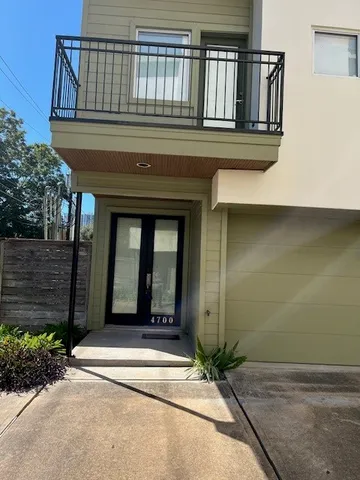 a view of a house with a small yard