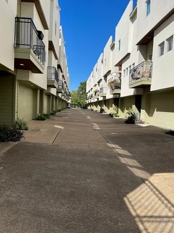 a street view with tall buildings