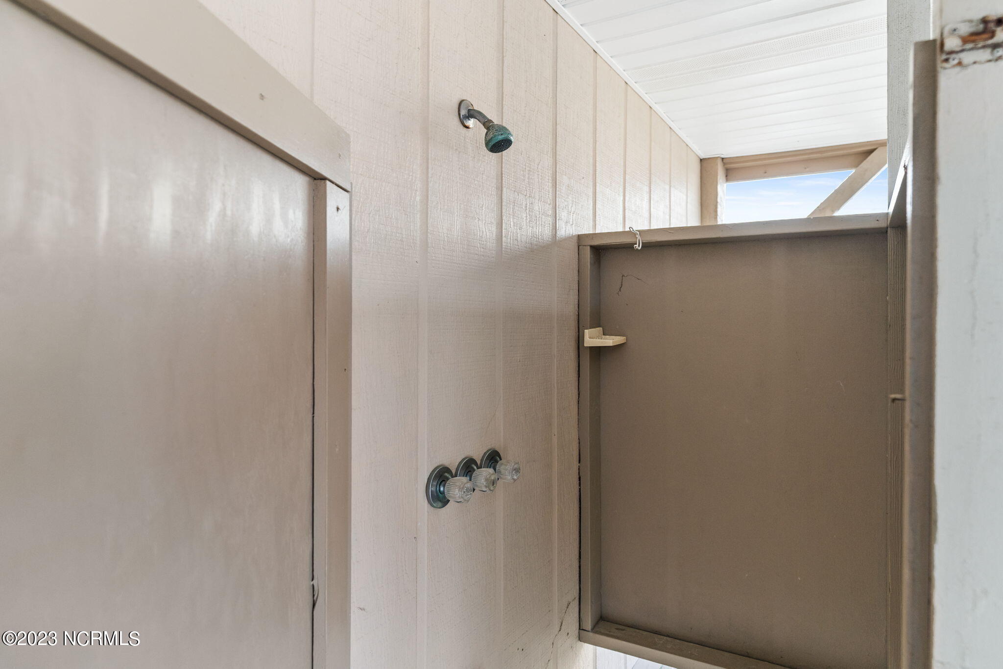 438 3rd Street Sunset Beach, NC 28468 - Photo 54 of 77 One of two outside showers.