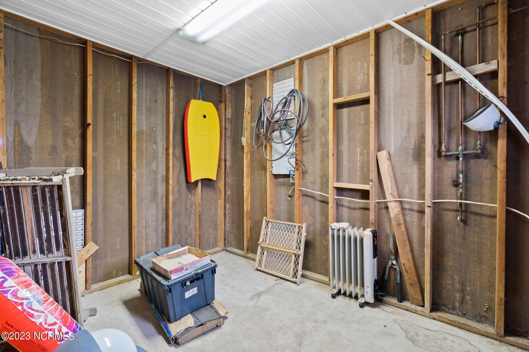 438 3rd Street Sunset Beach, NC 28468 - Photo 59 of 77 Additional downstairs storage room.