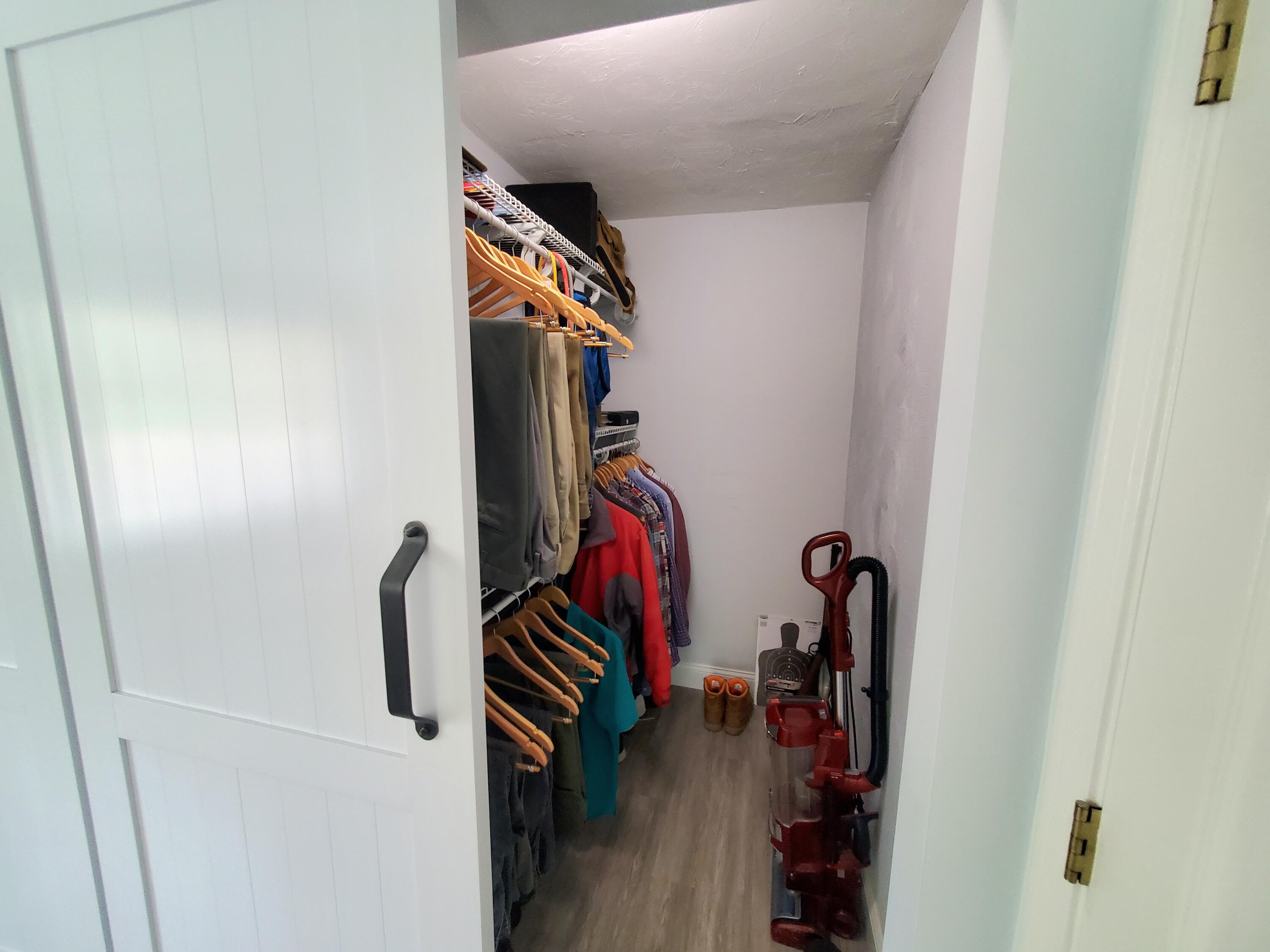 52 Thayer Road Dennis, MA 02660 - Photo 14 of 19 a view of walk in closet with clothes