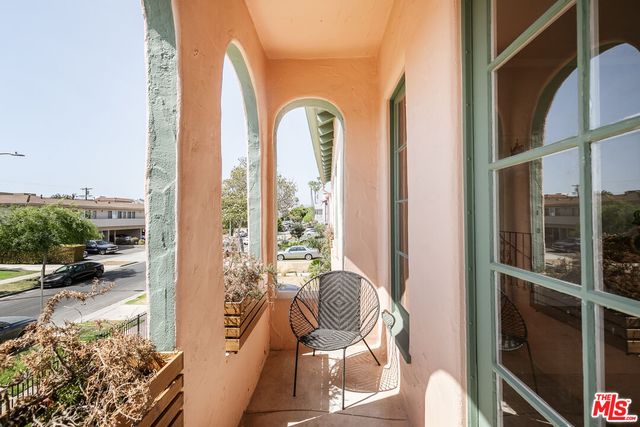 a view of balcony with furniture