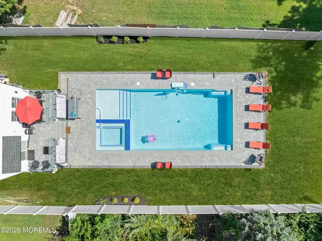a bathroom with a double vanity sink toilet and shower