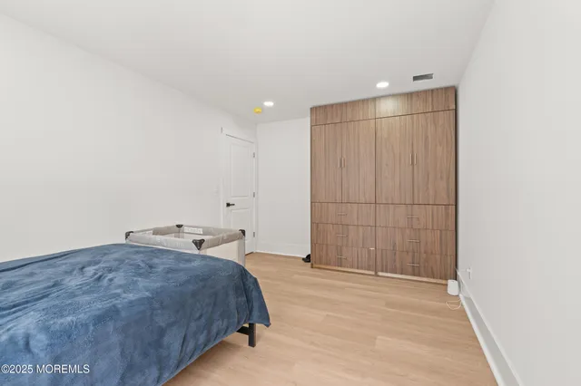 a bedroom with a bed and a table