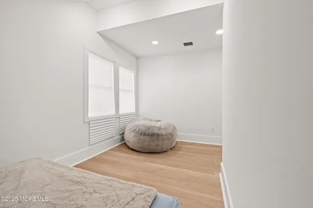 a room with a bed and a window