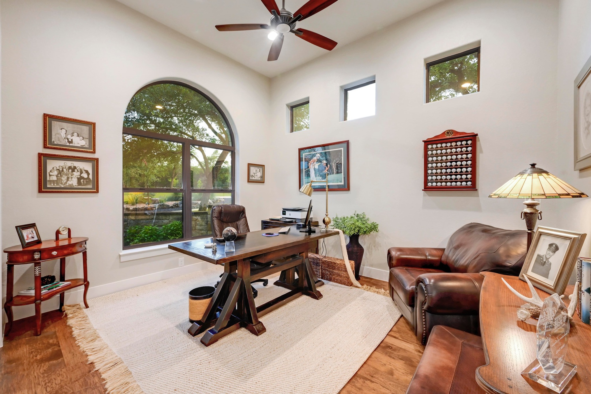401 Trail Ridge Road Wimberley, TX 78676 - Photo 16 of 34 Office space with wood finished floors, ceiling fan, and a high ceiling