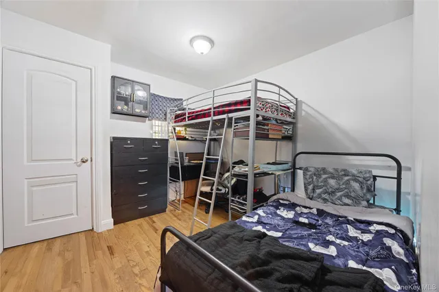 a bedroom with a bed and cabinets