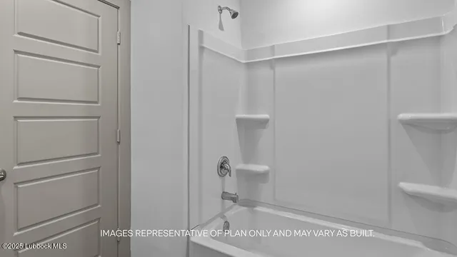 a bathroom with a shower and toilet