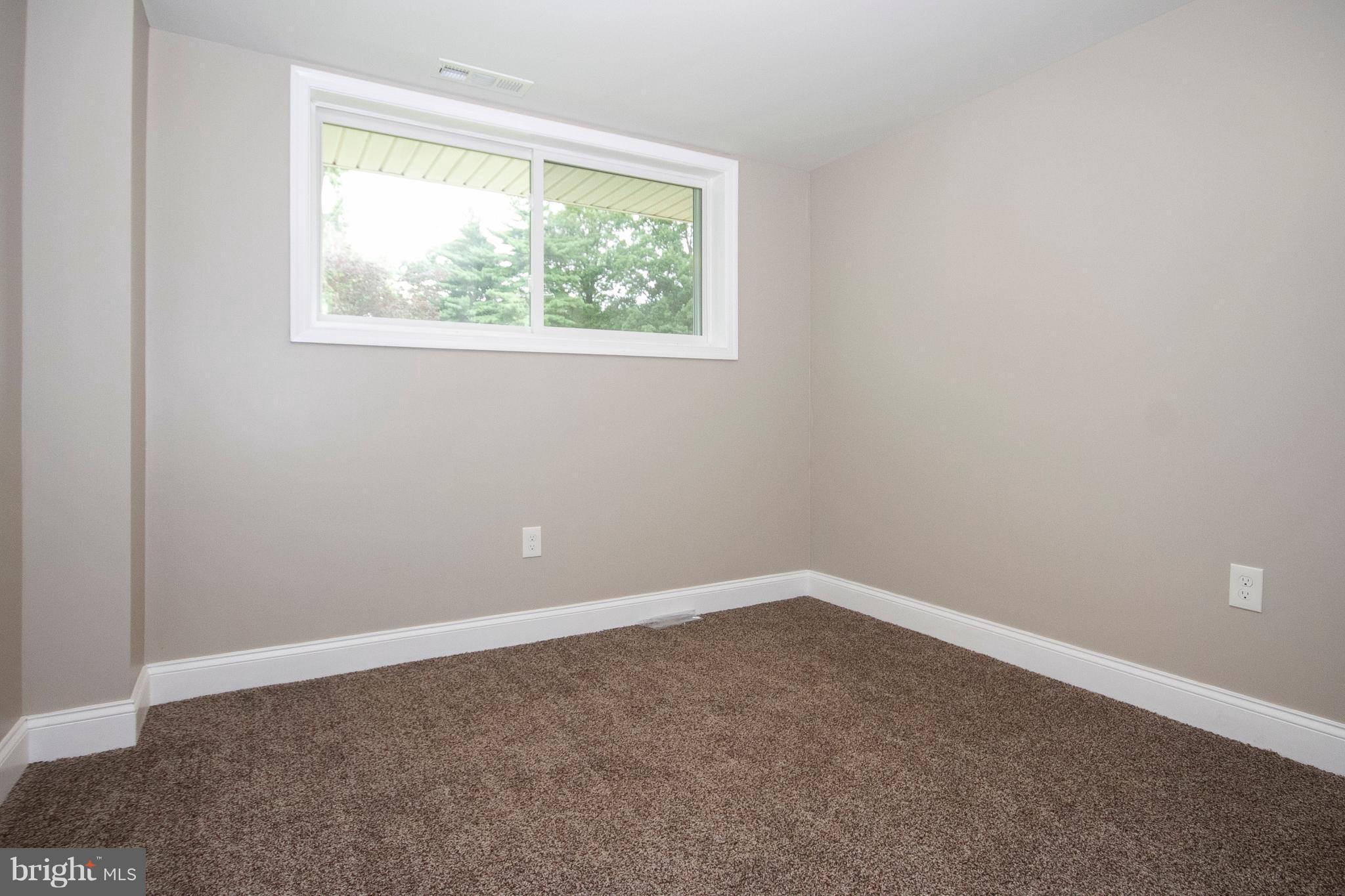 7412 Prince George Road Baltimore, MD 21208 - Photo 15 of 22 an empty room with a window