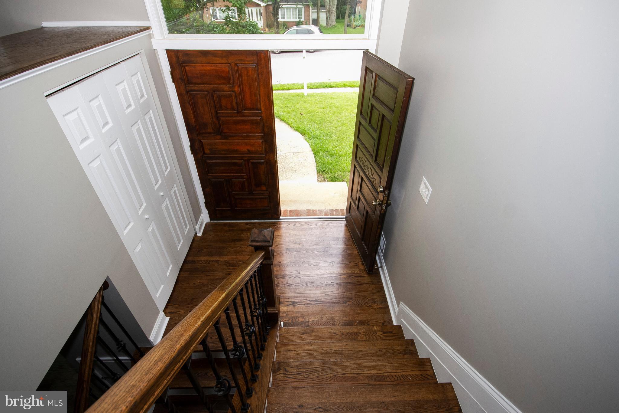 7412 Prince George Road Baltimore, MD 21208 - Photo 19 of 22 a view of stairs with wooden floor