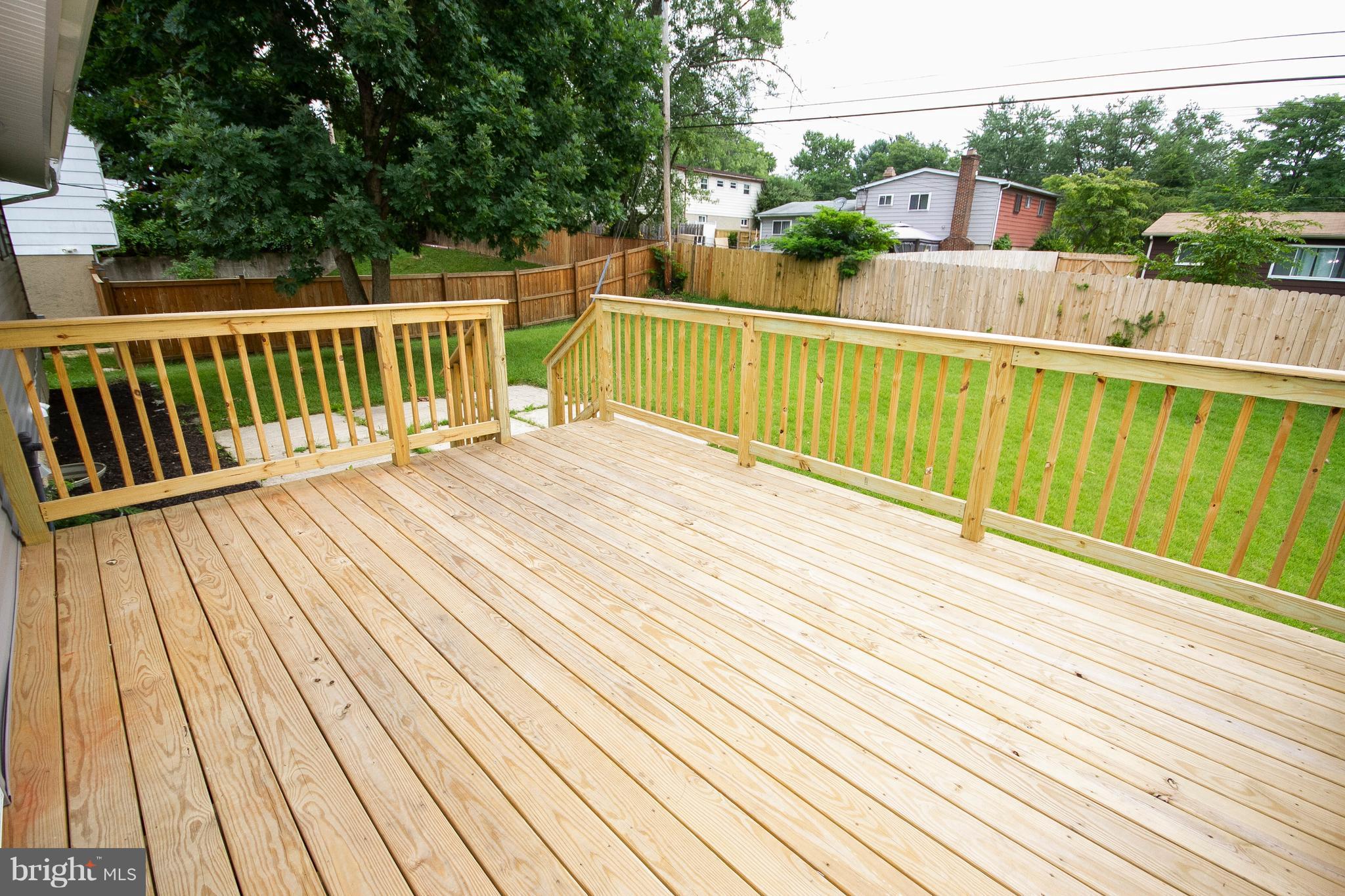 7412 Prince George Road Baltimore, MD 21208 - Photo 21 of 22 a view of balcony with wooden floor and outdoor space