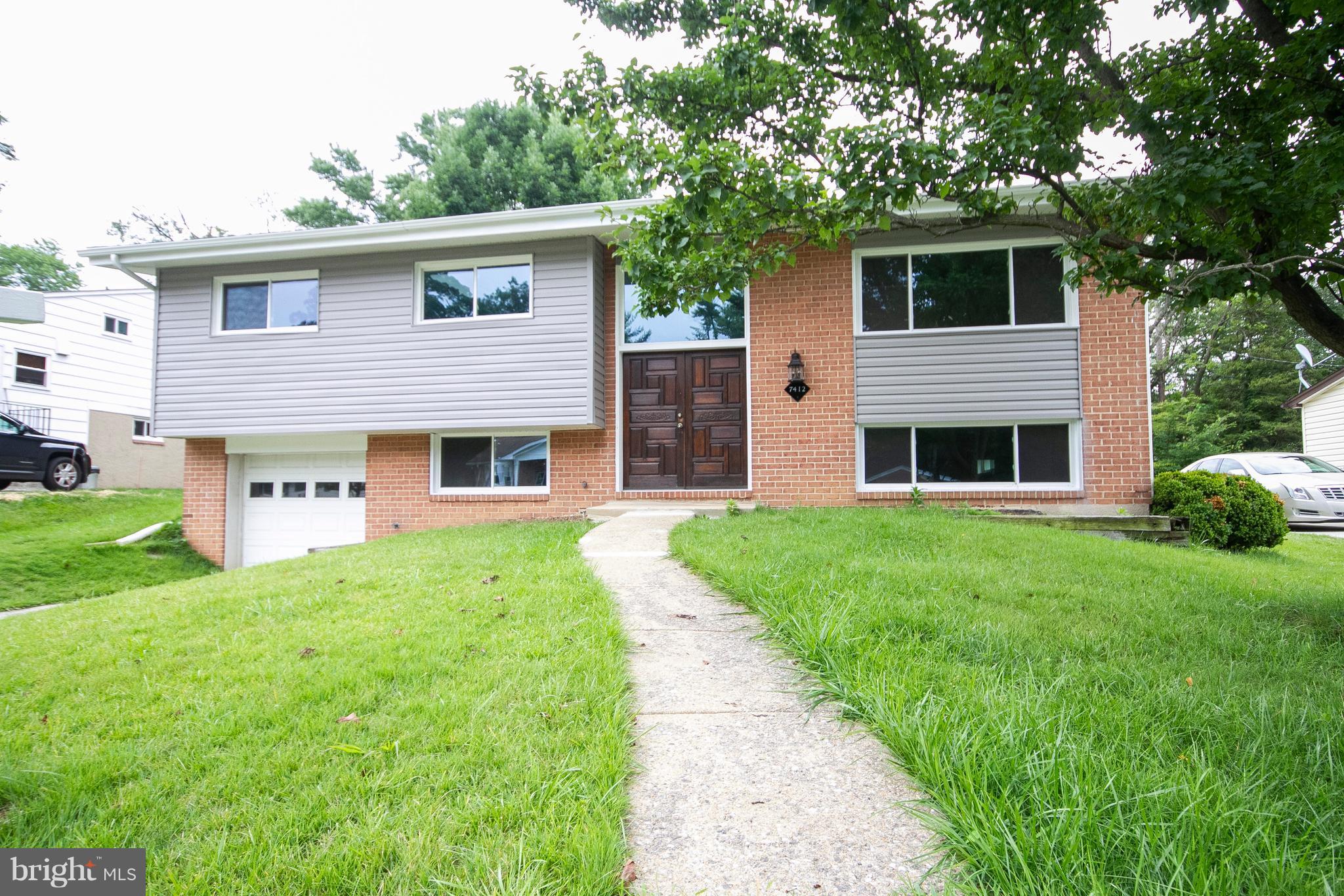 7412 Prince George Road Baltimore, MD 21208 - Photo 22 of 22 a front view of house with yard and green space