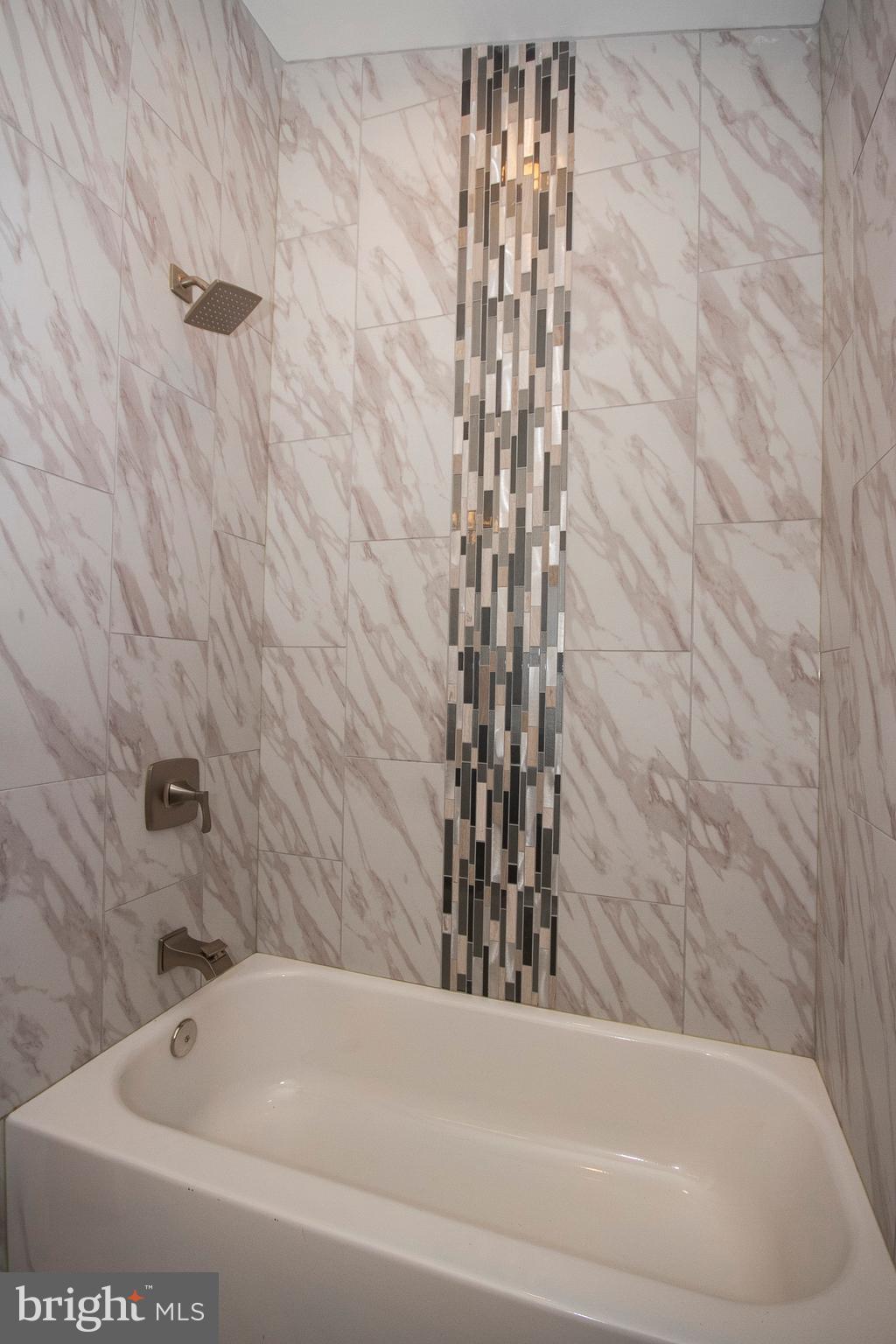 7412 Prince George Road Baltimore, MD 21208 - Photo 6 of 22 a bathroom with a bathtub and shower