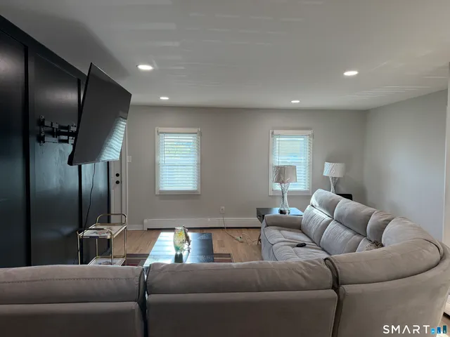 a living room with furniture and a window