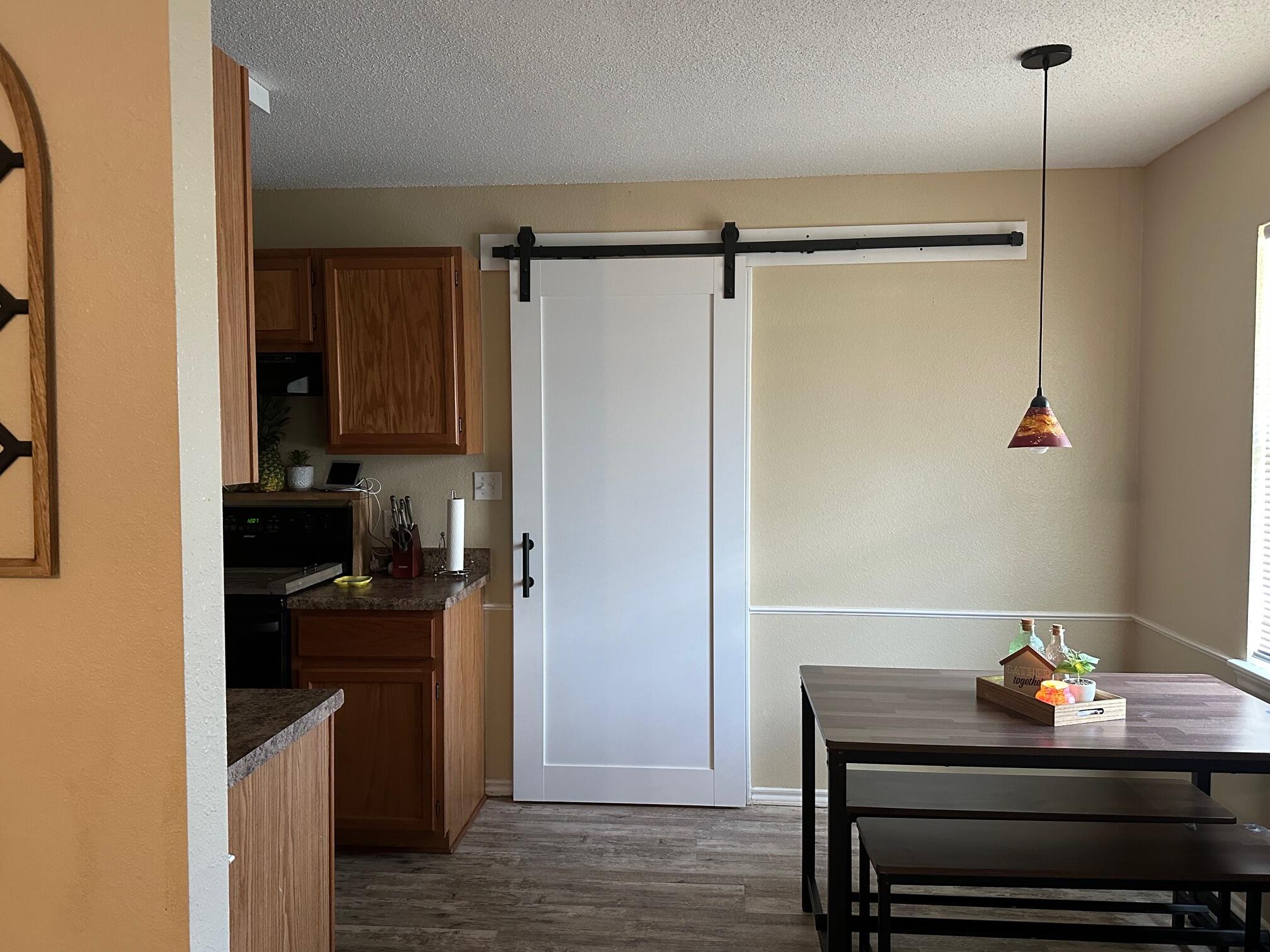 4304 East 63rd Street Lubbock, TX 79403 - Photo 5 of 14 DINING WITH BARN DOOR