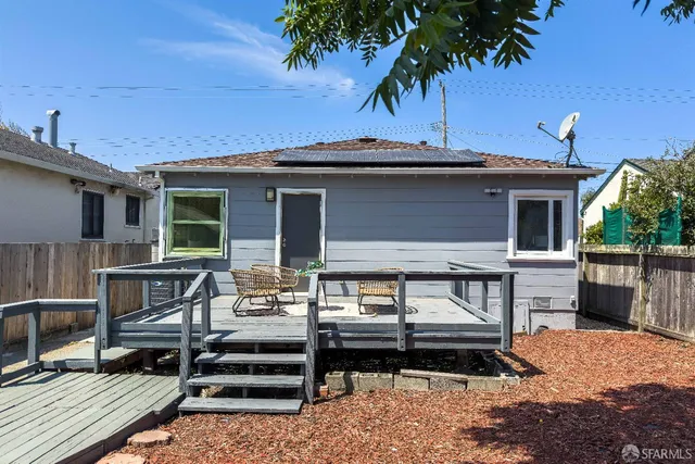 a view of a patio with table and chairs a barbeque with potted plants