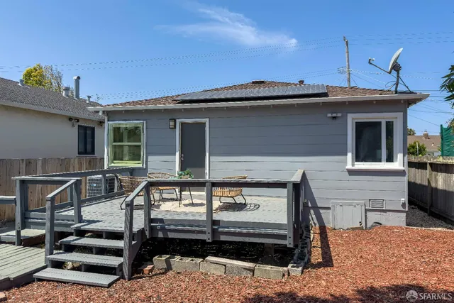a chairs and a table in a balcony