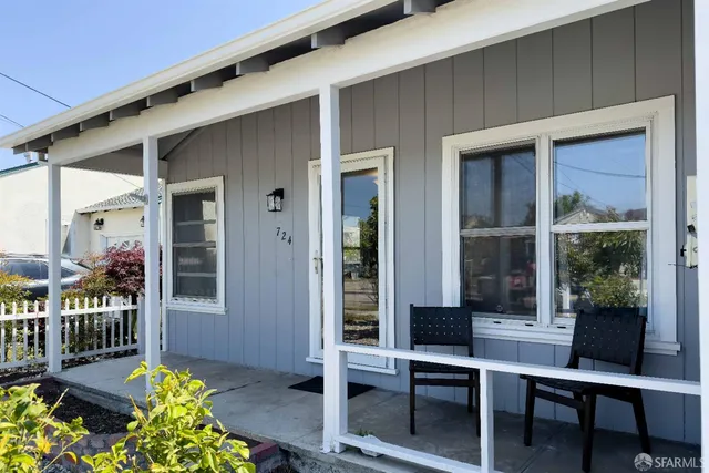a front view of a house with glass windows