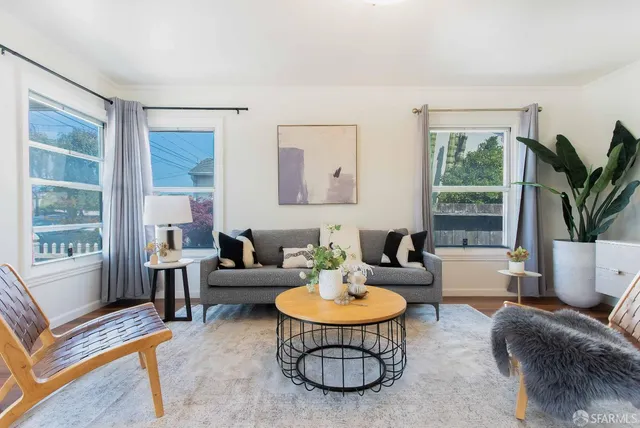 a living room with furniture and a table