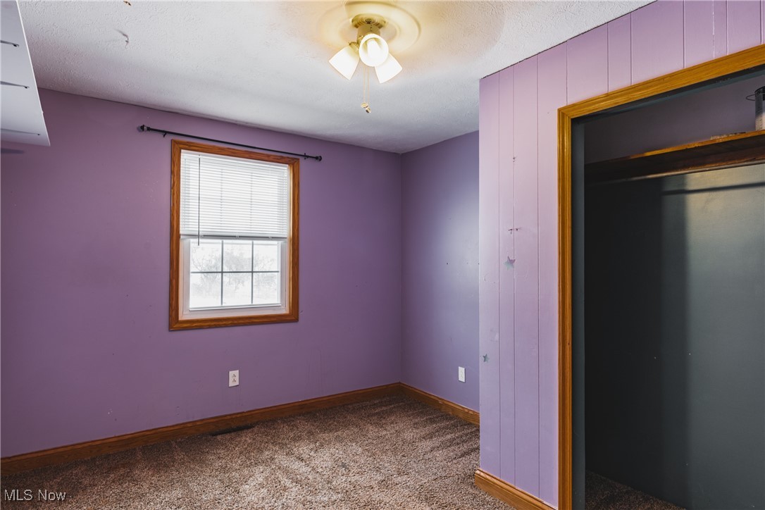 111 River Hill Road Washington, WV 26181 - Photo 20 of 29 A 13 x 10 (approx.) bedroom space with again, large closet and neutral carpet.