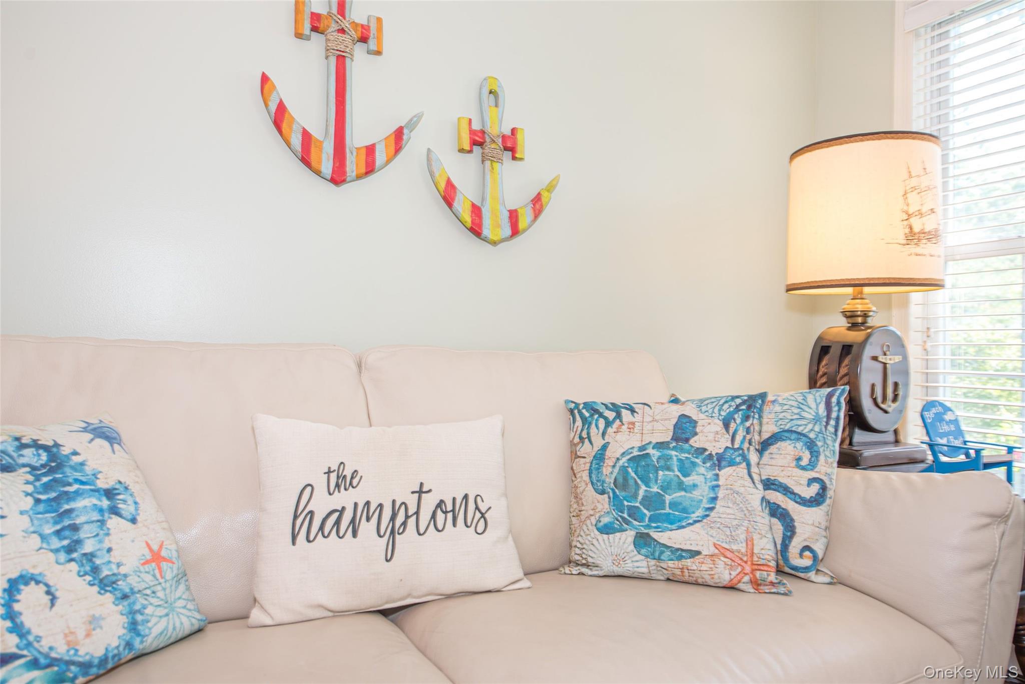 63 East Tiana Road Hampton Bays, NY 11946 - Photo 11 of 30 a bedroom with a bed and a table