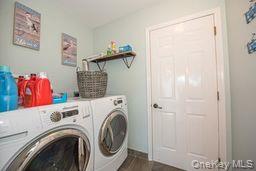 63 East Tiana Road Hampton Bays, NY 11946 - Photo 15 of 30 a view of walk in closet with clothes and shoes